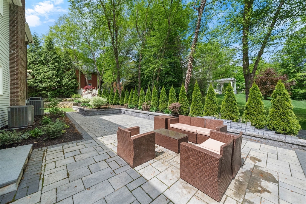 49 Longfellow Road Wellesley, MA 02481 - Photo 8 of 8 a view of patio with couches and trees