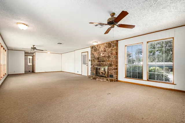 a view of a room with wooden walls
