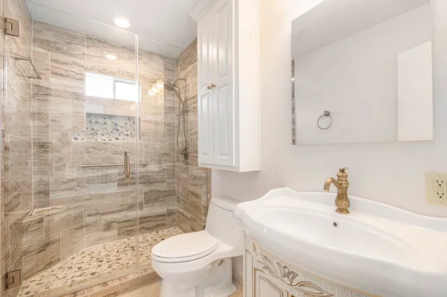 a view of a chair and tables in the garden