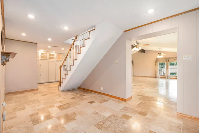 a view of a kitchen with a sink and a fireplace