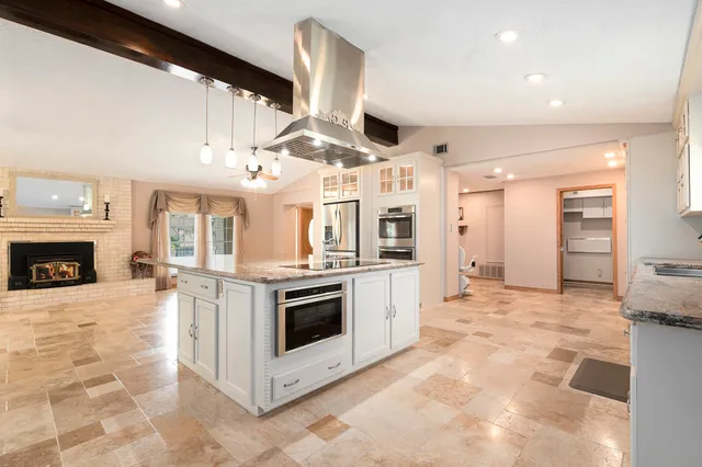 a view of a kitchen with furniture and a kitchen view