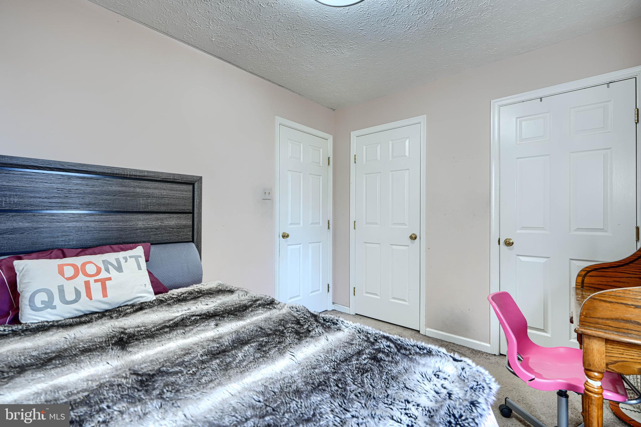 4 High Side Court Owings Mills, MD 21117 - Photo 14 of 30 a bedroom with a bed and chair