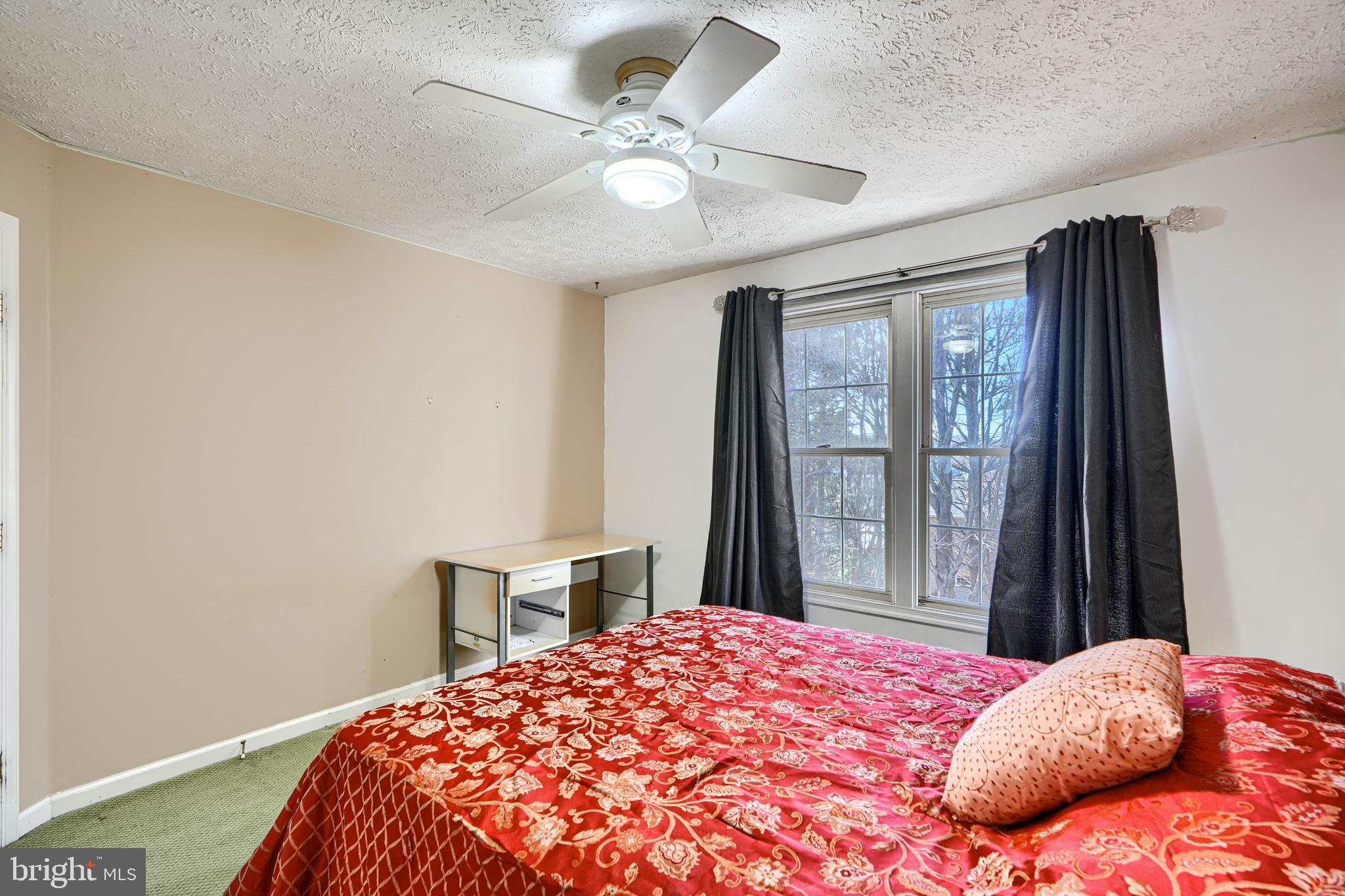 4 High Side Court Owings Mills, MD 21117 - Photo 15 of 30 a bedroom with a large bed and a window