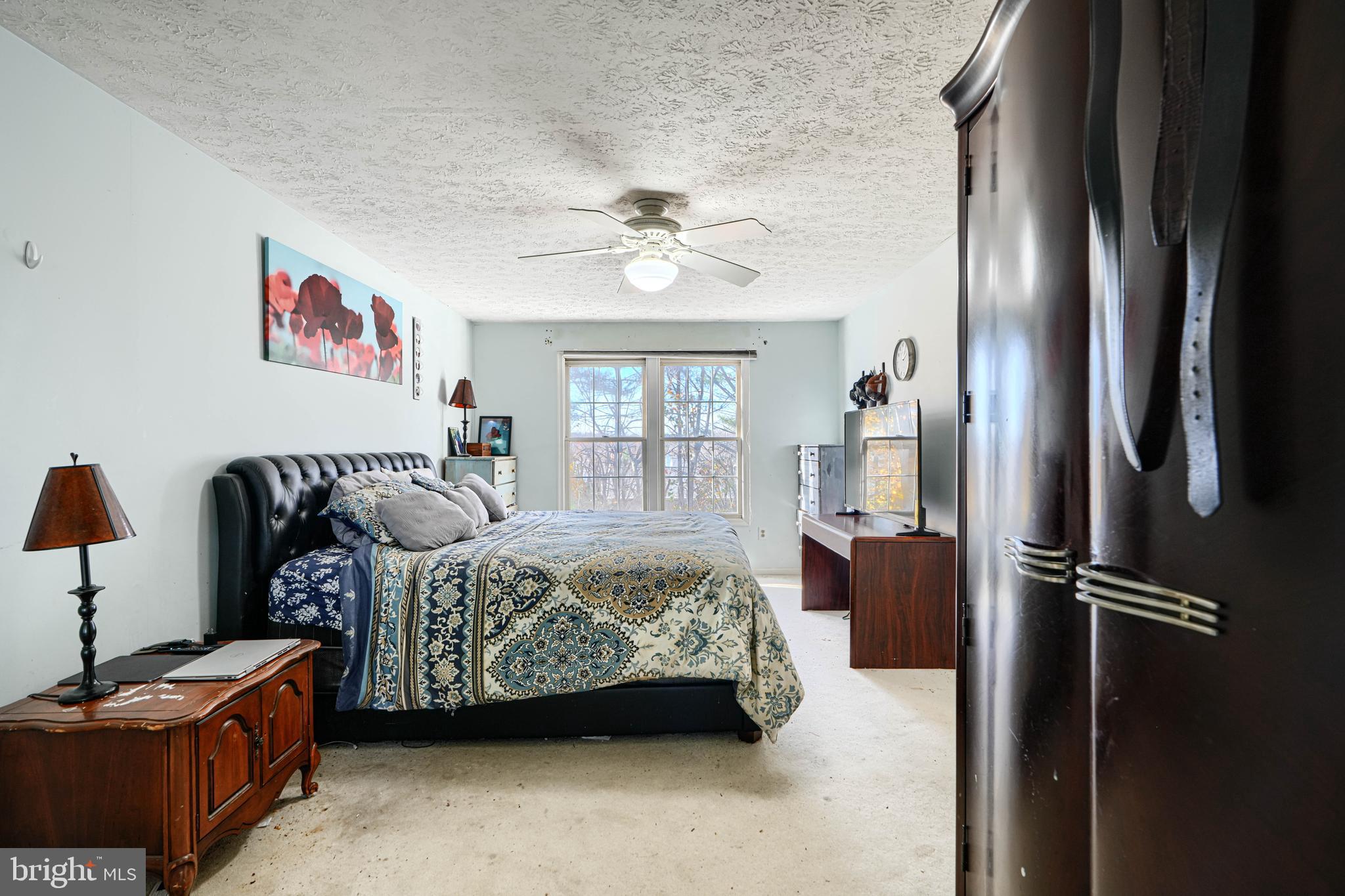 4 High Side Court Owings Mills, MD 21117 - Photo 19 of 30 a bed room with a bed and a chandelier