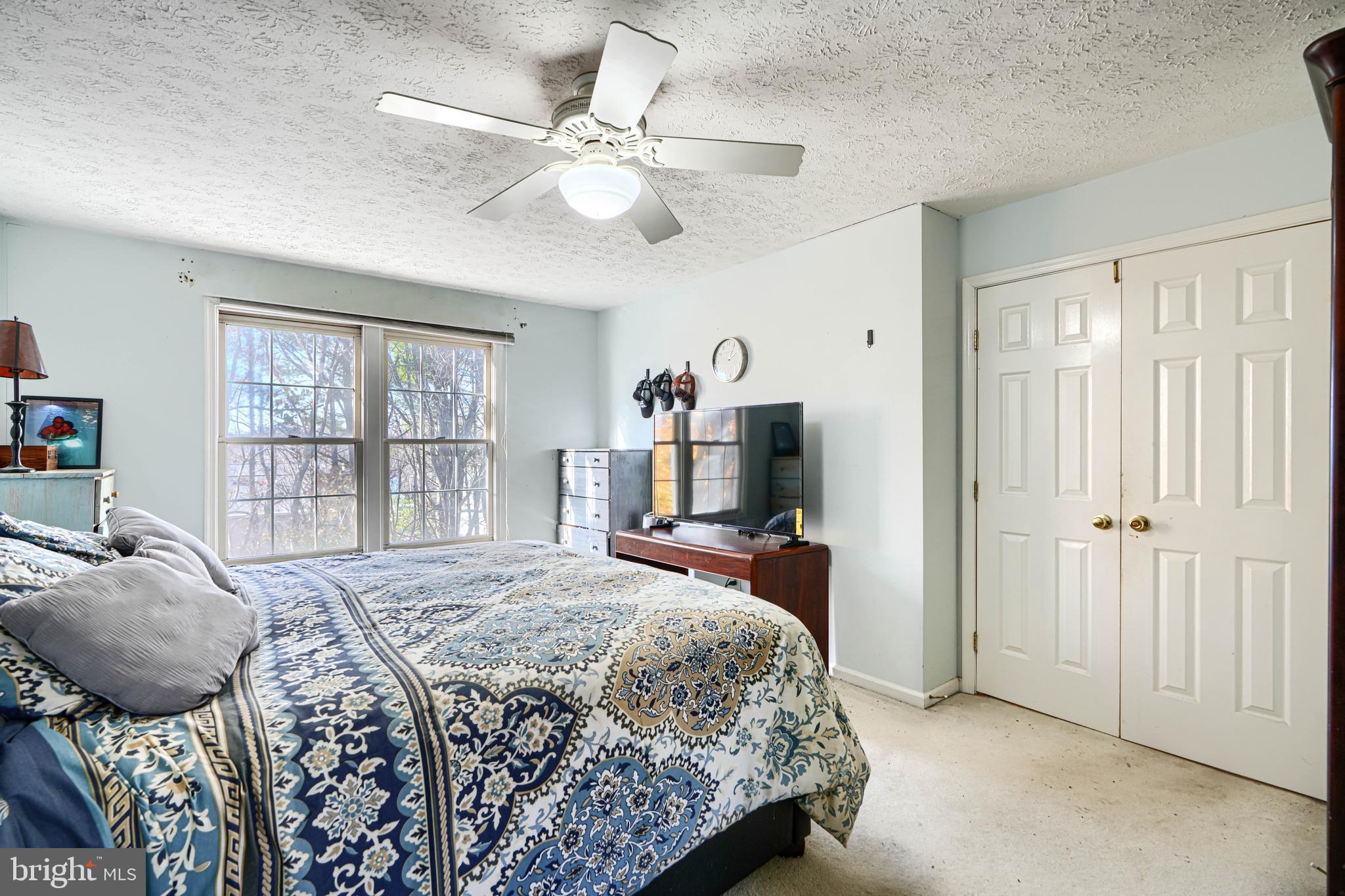 4 High Side Court Owings Mills, MD 21117 - Photo 20 of 30 a bedroom with a bed and furniture