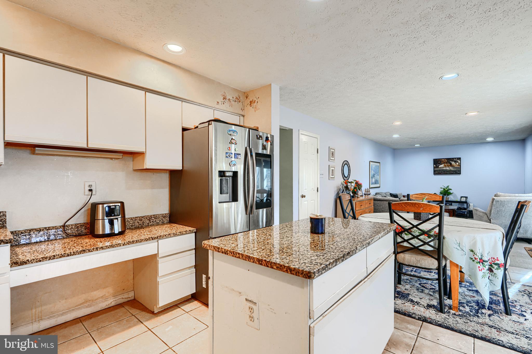 4 High Side Court Owings Mills, MD 21117 - Photo 8 of 30 a kitchen with stainless steel appliances granite countertop a sink a refrigerator and white cabinets