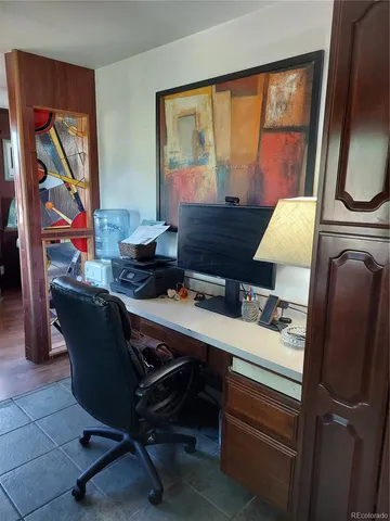 a room with wooden floor and furniture