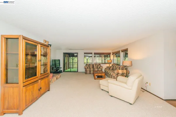 view of living room with furniture and large windows