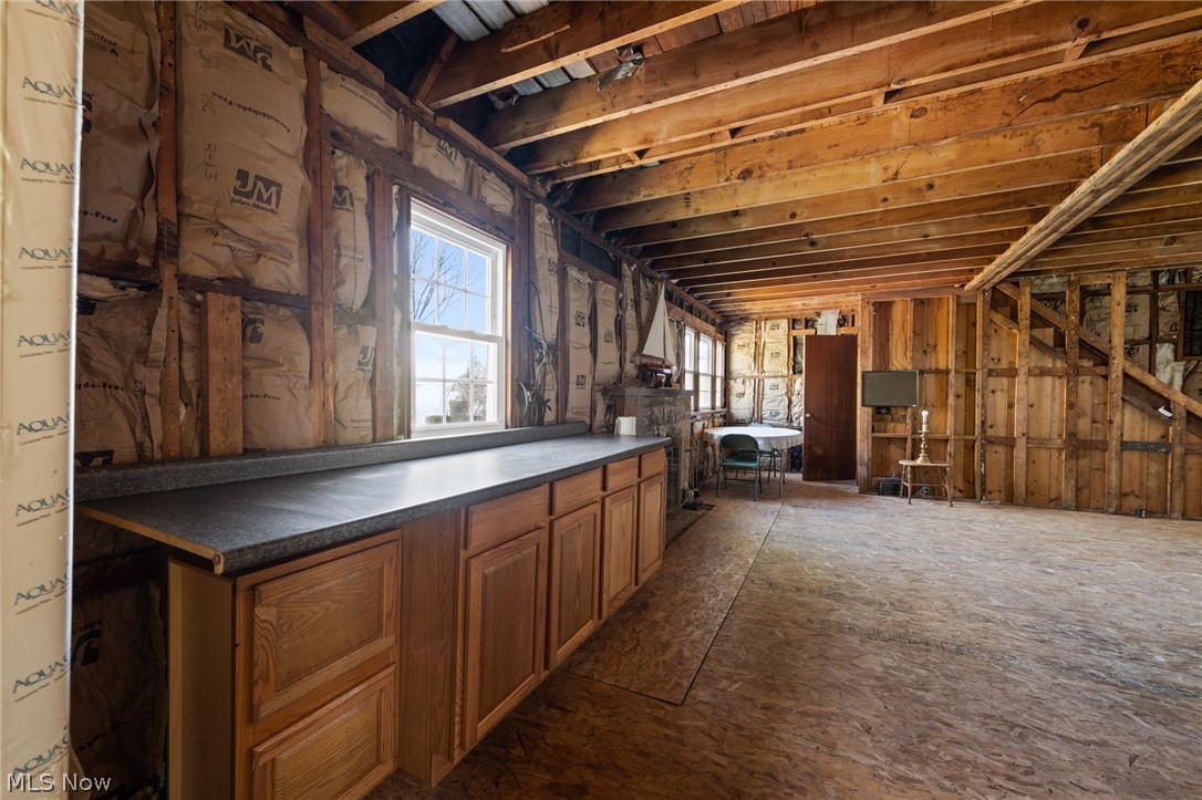 32601 Eddy Road Willoughby, OH 44094 - Photo 10 of 22 Unfinished interior space featuring exposed wood framing, ceiling joists, and subfloor