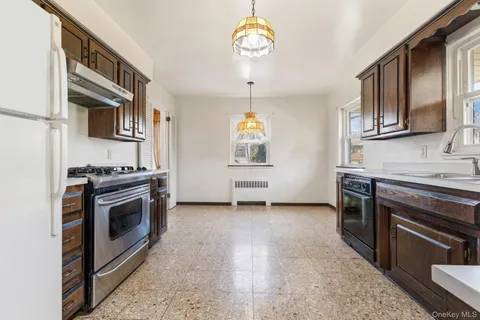 a kitchen with stainless steel appliances granite countertop a stove and a sink