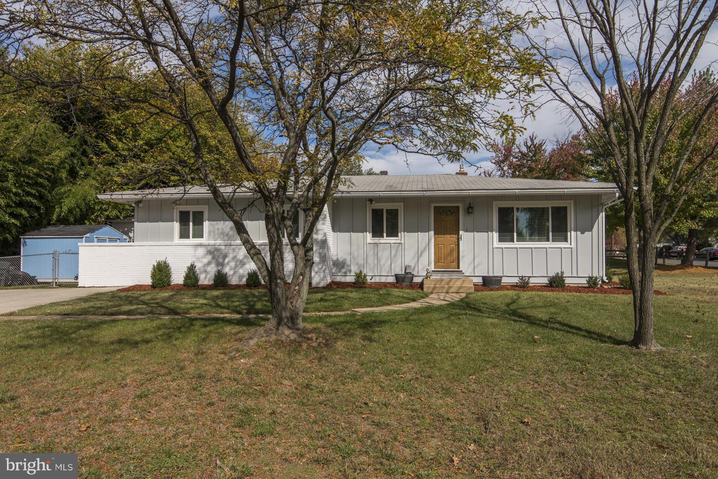 6203 Apache Street Springfield, VA 22150 - Photo 22 of 22 a view of a house with a yard and large tree