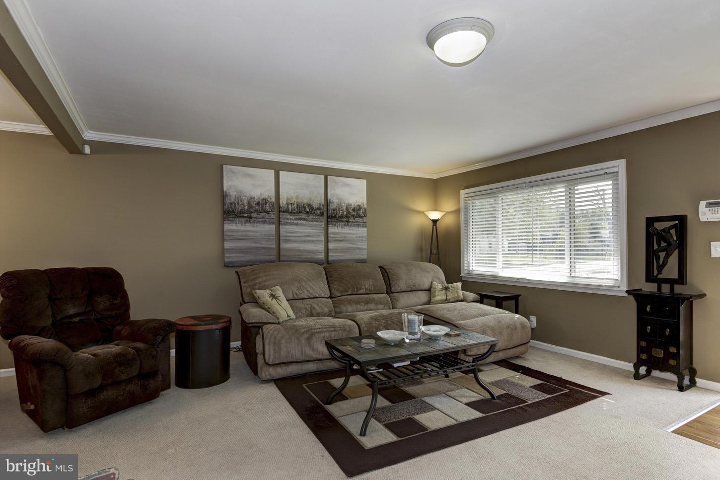 6203 Apache Street Springfield, VA 22150 - Photo 4 of 22 a living room with furniture and a flat screen tv