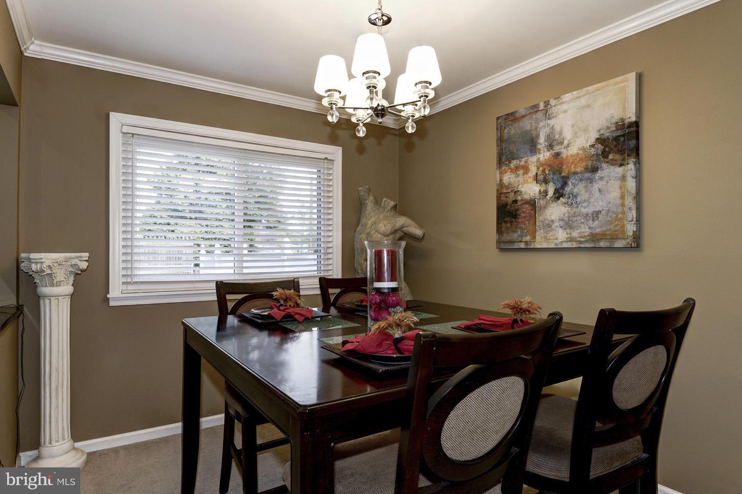 6203 Apache Street Springfield, VA 22150 - Photo 6 of 22 a view of a dining room with furniture window and outside view