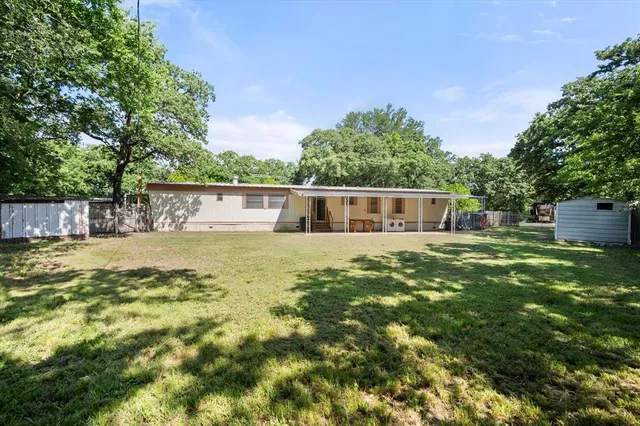 a swimming pool with outdoor seating and deck