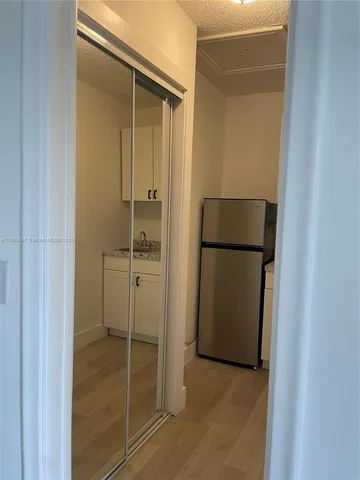 a bathroom with a shower and closet