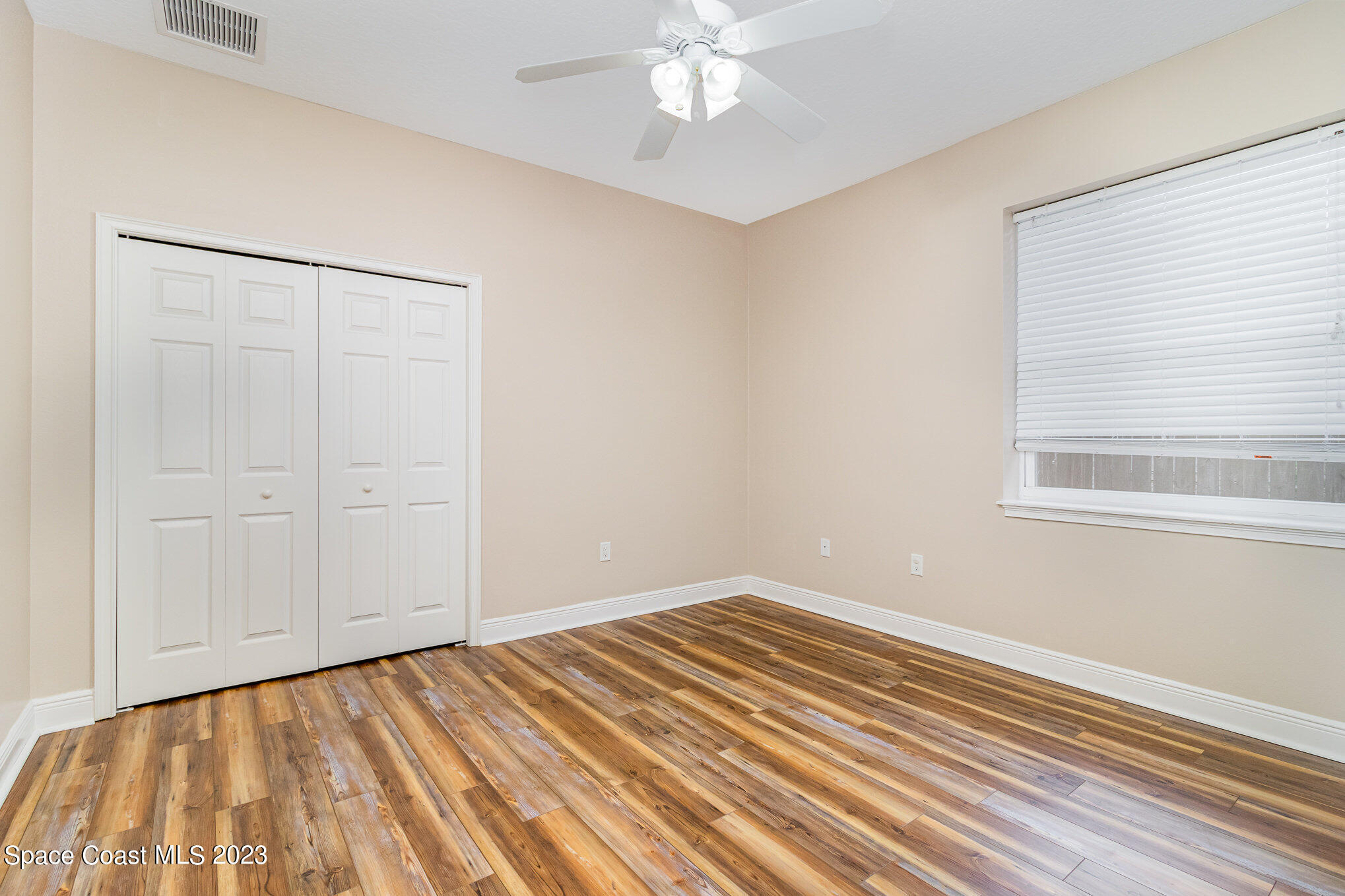 113 Palm Circle Melbourne, FL 32940 - Photo 11 of 16 a view of a room with wooden floor and closet area