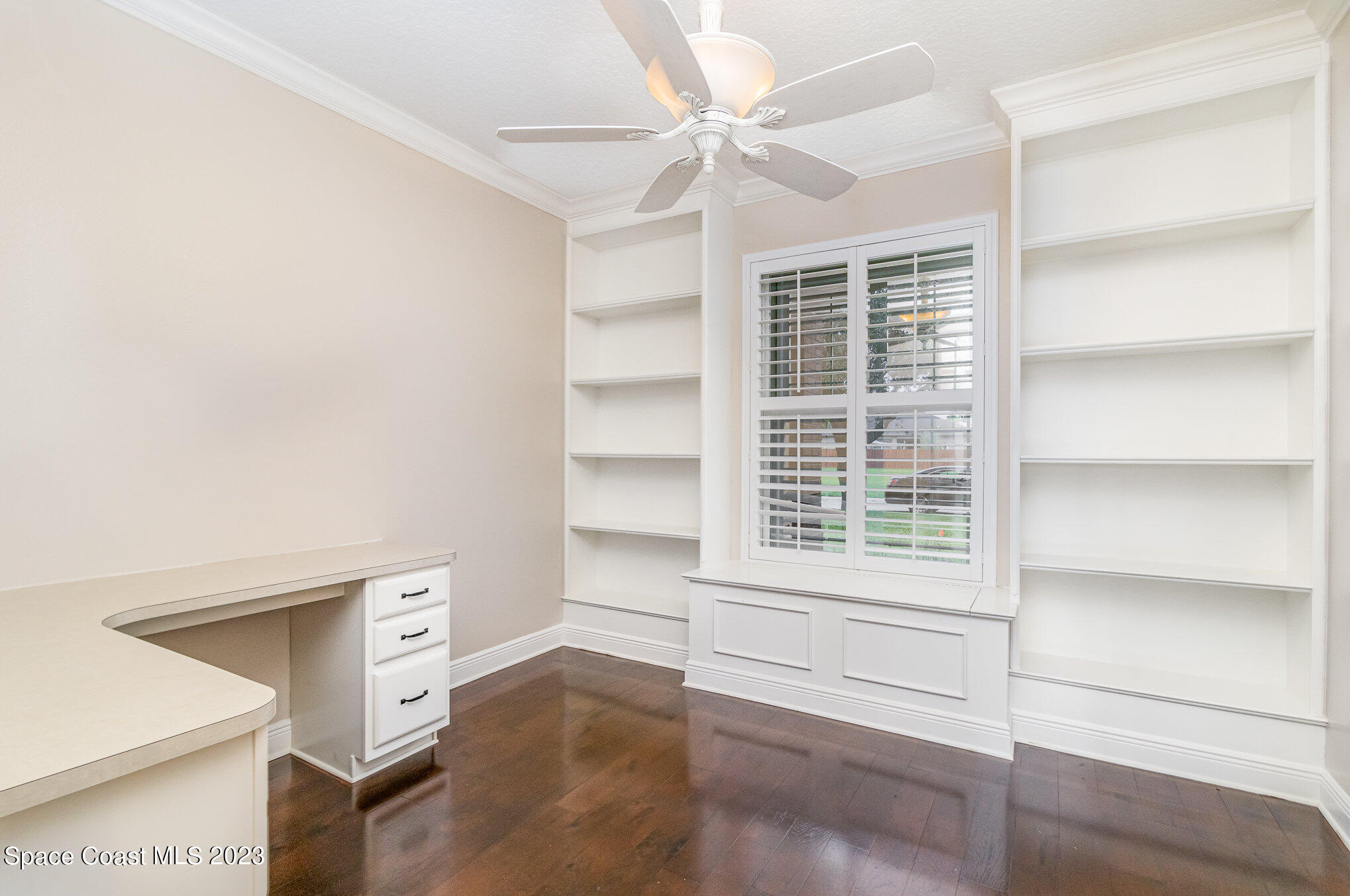 113 Palm Circle Melbourne, FL 32940 - Photo 5 of 16 a view of room with window and a ceiling fan