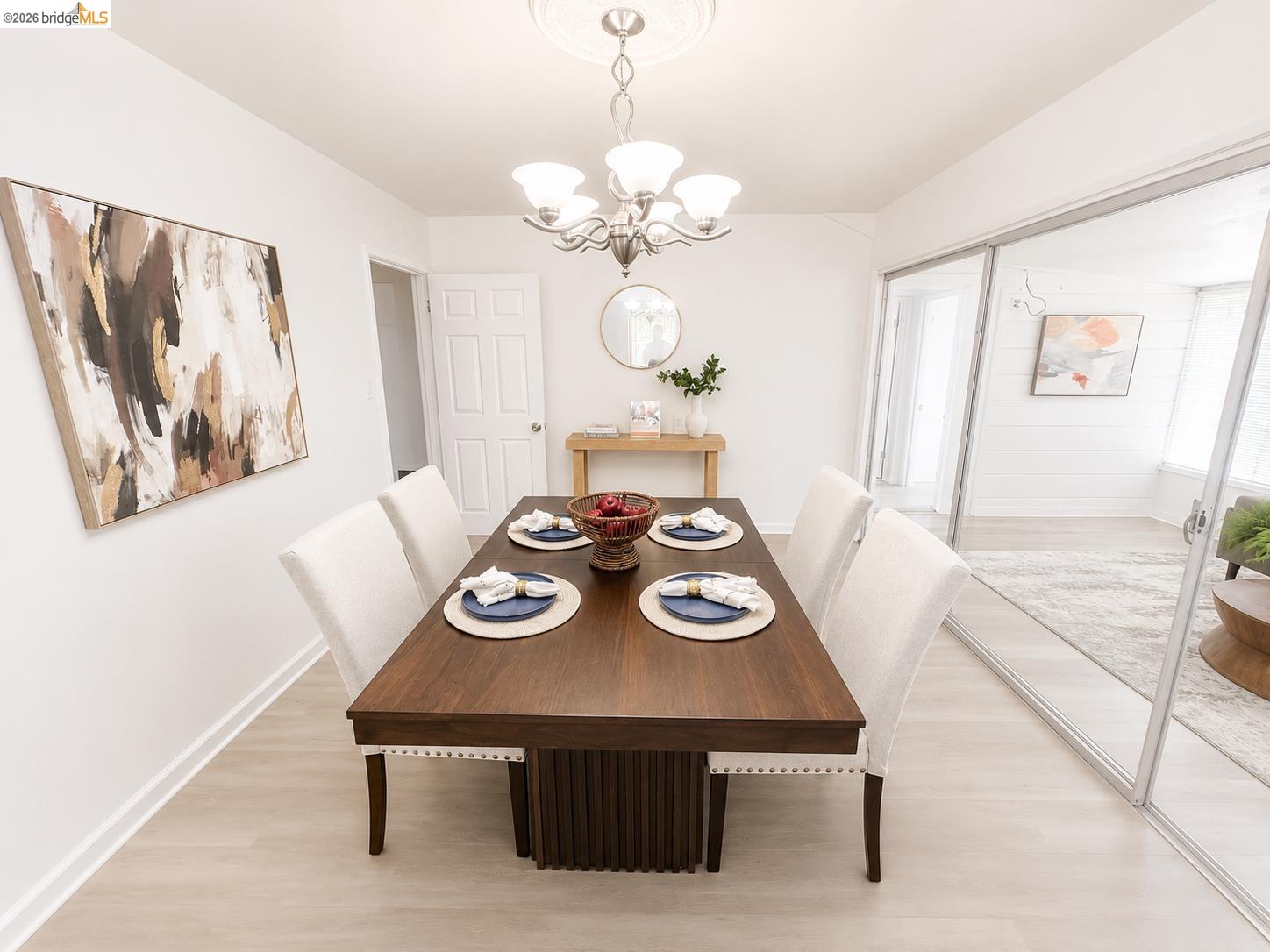 810 Pierce Street Albany, CA 94706 - Photo 12 of 25 Formal dining space featuring light wood-finish flooring and a contemporary chandelier