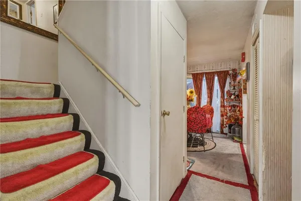a view of a room with lots of stuff and hardwood floor