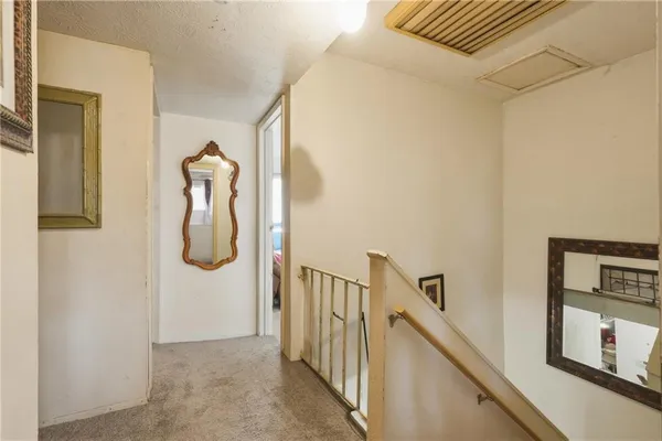 a view of a hallway with staircase