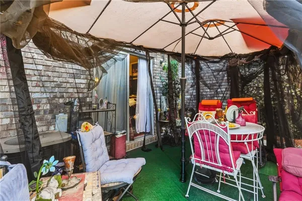 a chair and tables in the patio
