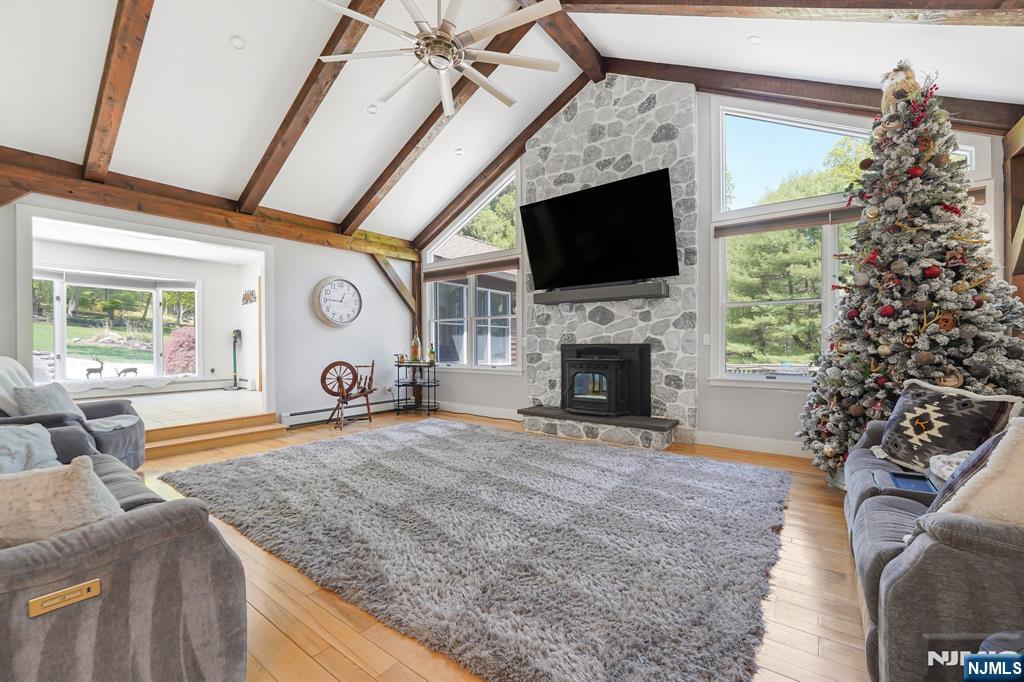 26 Danville Mountain Road Great Meadows, NJ 07838 - Photo 12 of 49 a living room with furniture a flat screen tv and a fireplace