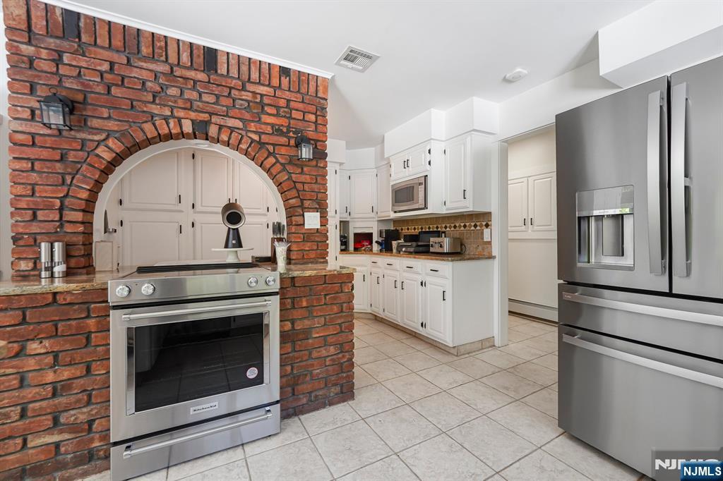 26 Danville Mountain Road Great Meadows, NJ 07838 - Photo 19 of 49 a kitchen with stainless steel appliances granite countertop a stove a refrigerator and a stove