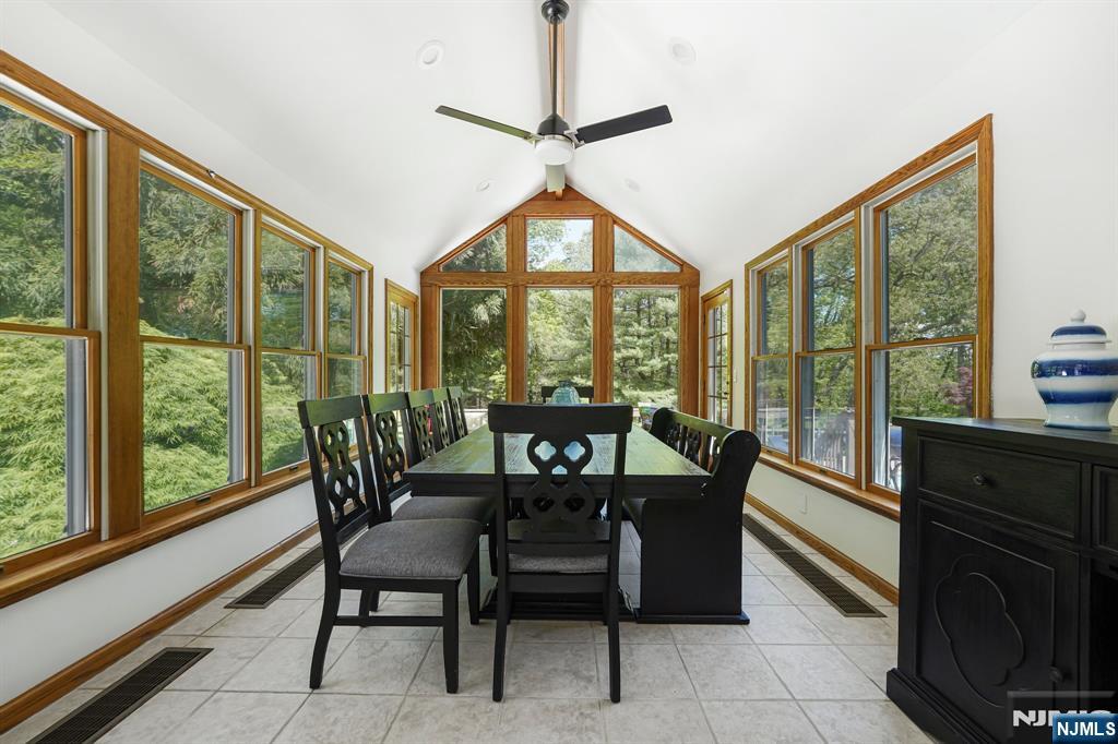 26 Danville Mountain Road Great Meadows, NJ 07838 - Photo 20 of 49 a dining room with furniture large windows and a chandelier