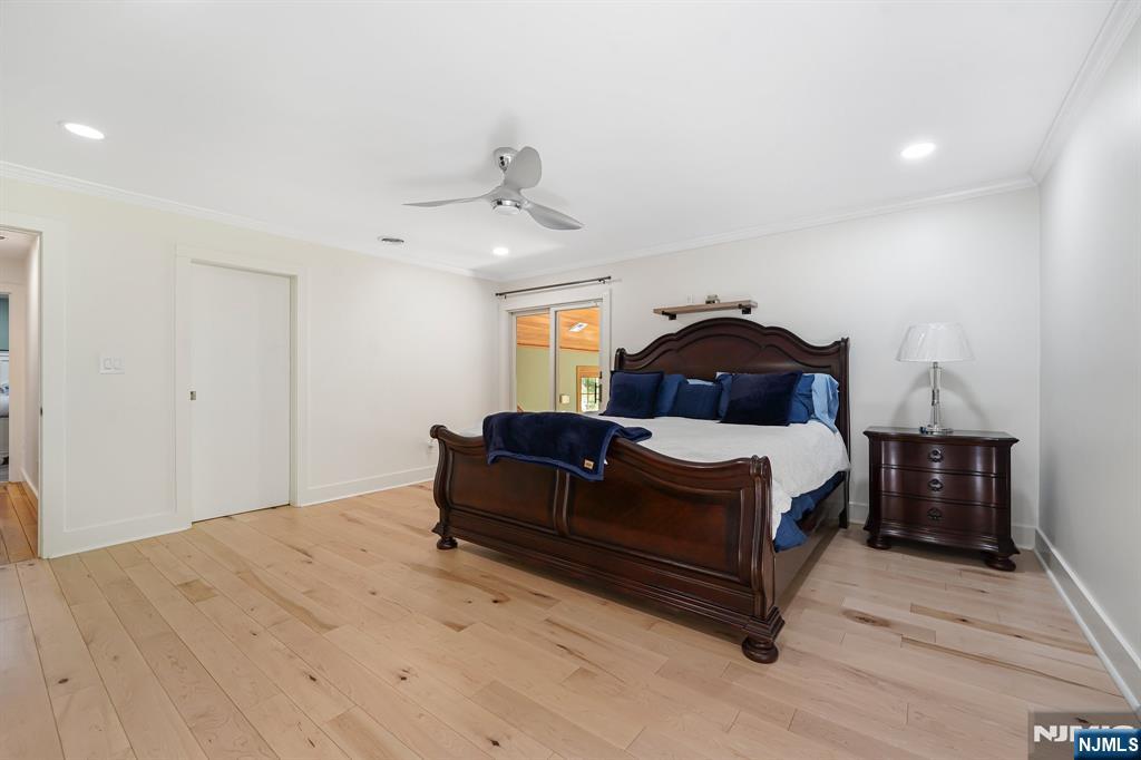 26 Danville Mountain Road Great Meadows, NJ 07838 - Photo 23 of 49 a bedroom with a bed and a chandelier