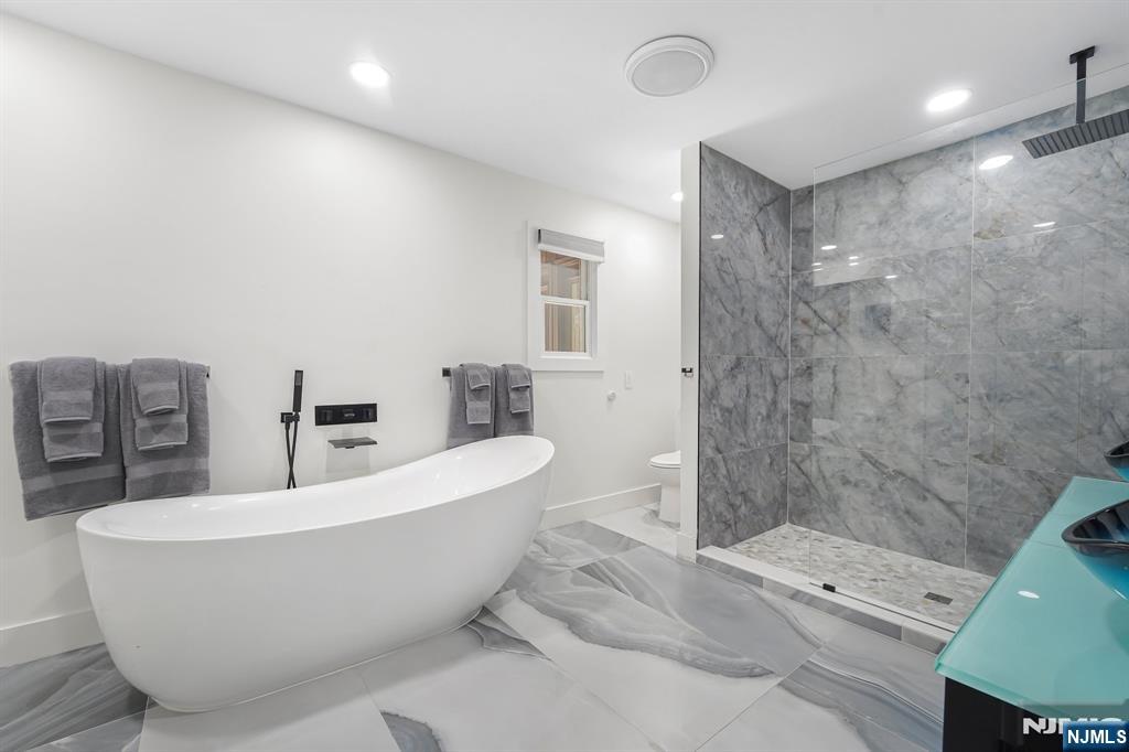 26 Danville Mountain Road Great Meadows, NJ 07838 - Photo 25 of 49 a bathroom with a white tub shower and sink