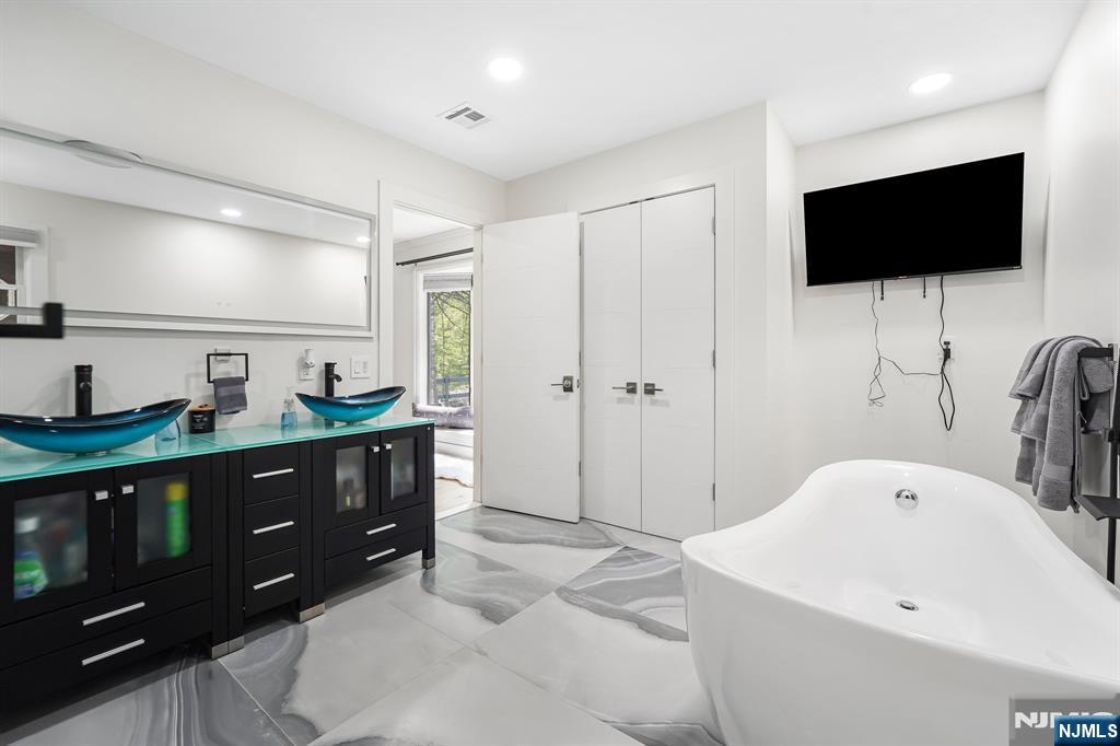 26 Danville Mountain Road Great Meadows, NJ 07838 - Photo 27 of 49 a spacious bathroom with a tub sink and mirror