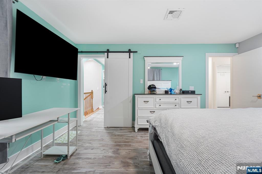 26 Danville Mountain Road Great Meadows, NJ 07838 - Photo 30 of 49 a bedroom with a bed and a flat screen tv