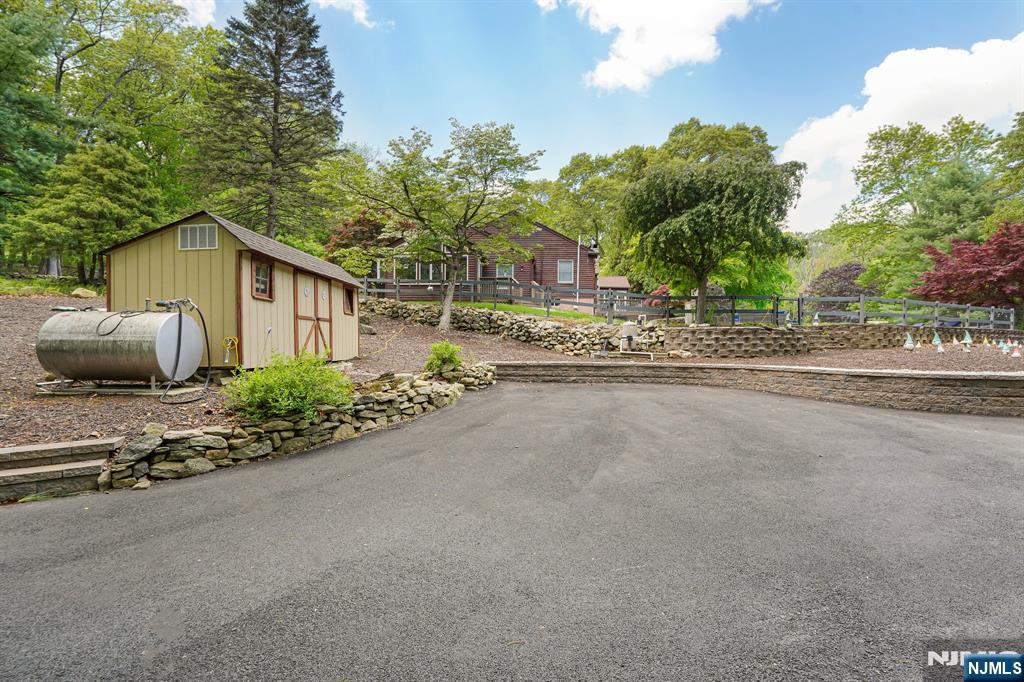 26 Danville Mountain Road Great Meadows, NJ 07838 - Photo 45 of 49 a view of a house with a garden and pathway