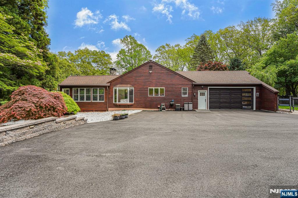 26 Danville Mountain Road Great Meadows, NJ 07838 - Photo 46 of 49 a front view of a house with a yard and garage
