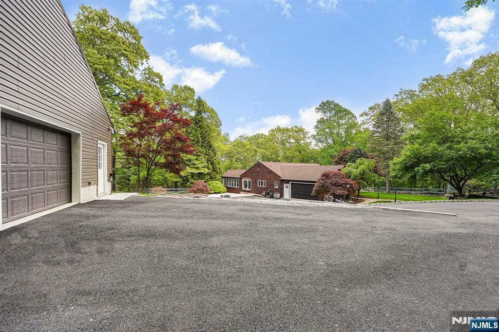 26 Danville Mountain Road Great Meadows, NJ 07838 - Photo 8 of 49 a front view of a house with a yard and garage