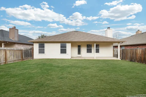 a front view of a house with yard