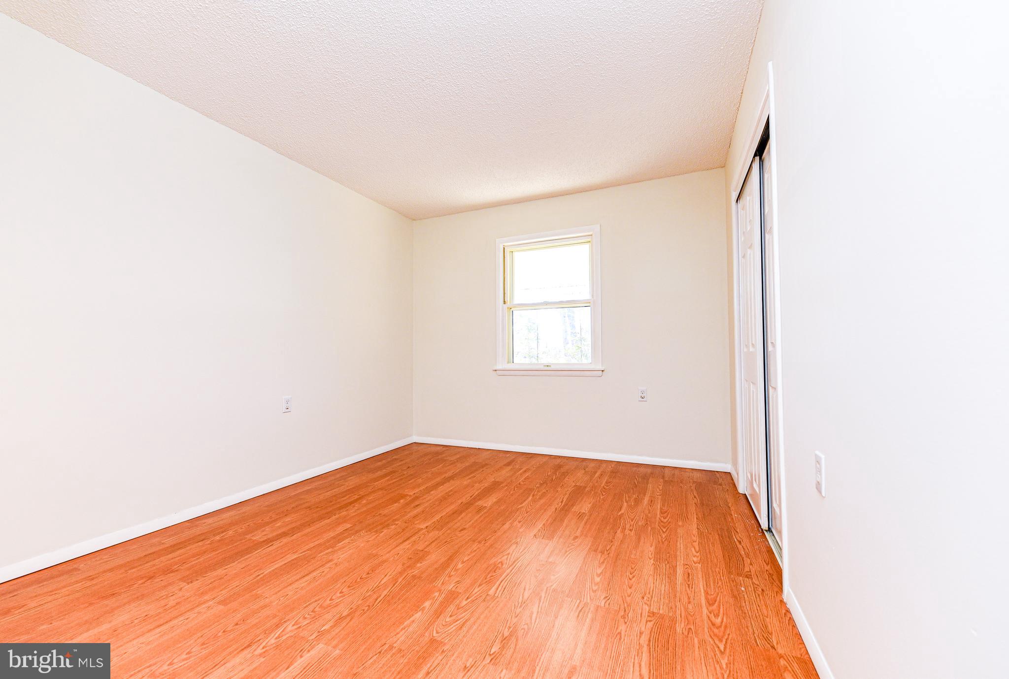 18 B Acorn Road Manahawkin, NJ 08050 - Photo 13 of 19 a view of empty room with wooden floor