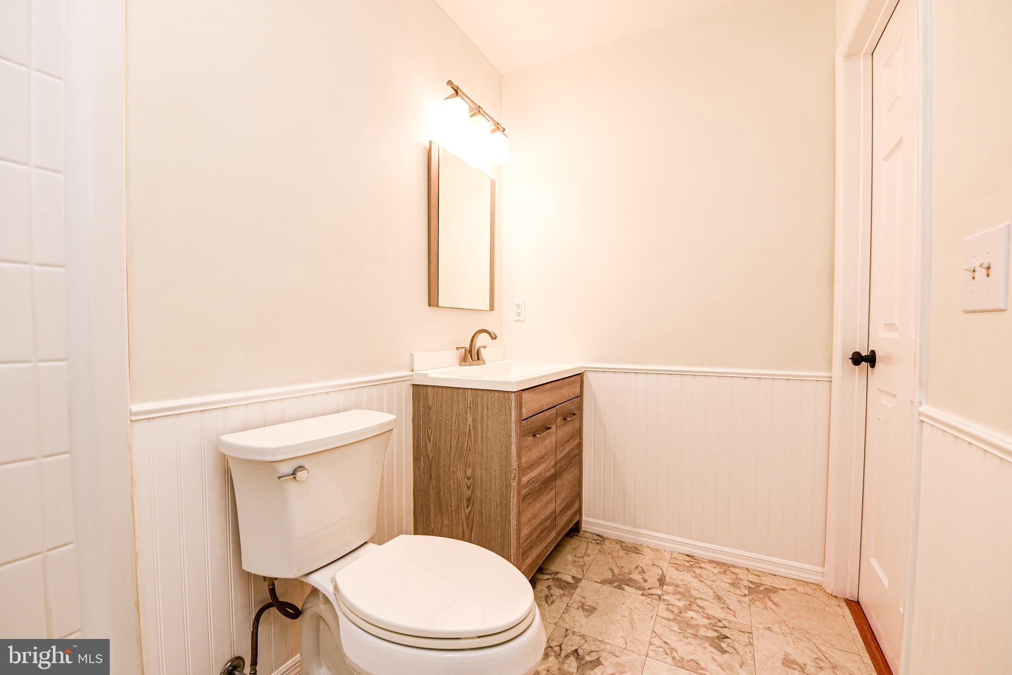 18 B Acorn Road Manahawkin, NJ 08050 - Photo 15 of 19 a bathroom with a toilet sink and shower