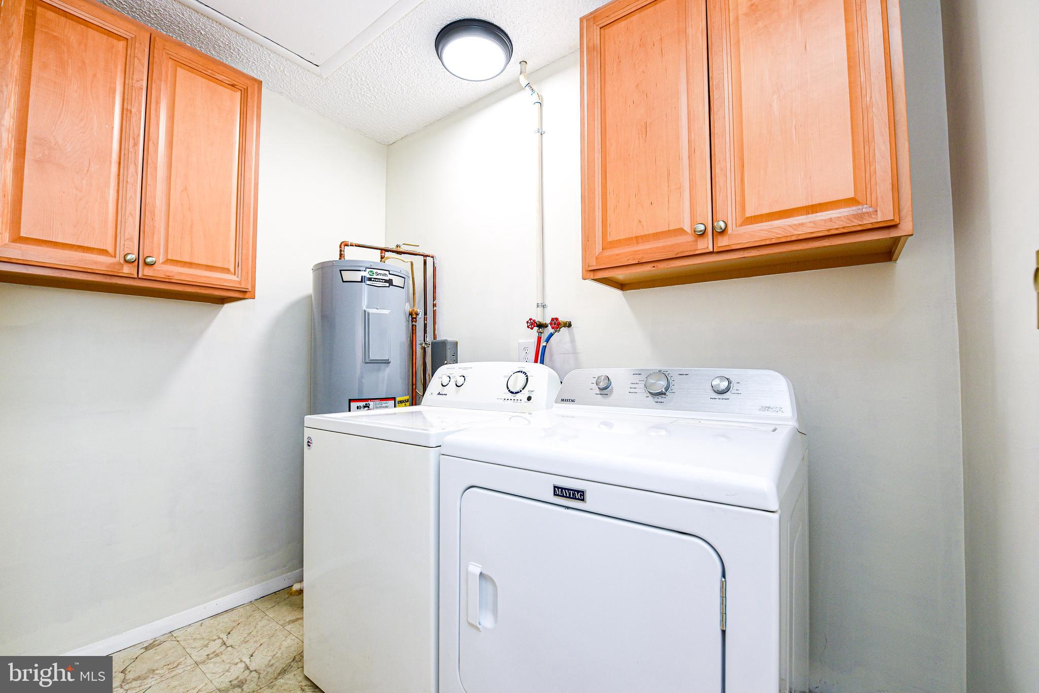 18 B Acorn Road Manahawkin, NJ 08050 - Photo 16 of 19 a utility room with dryer and washer