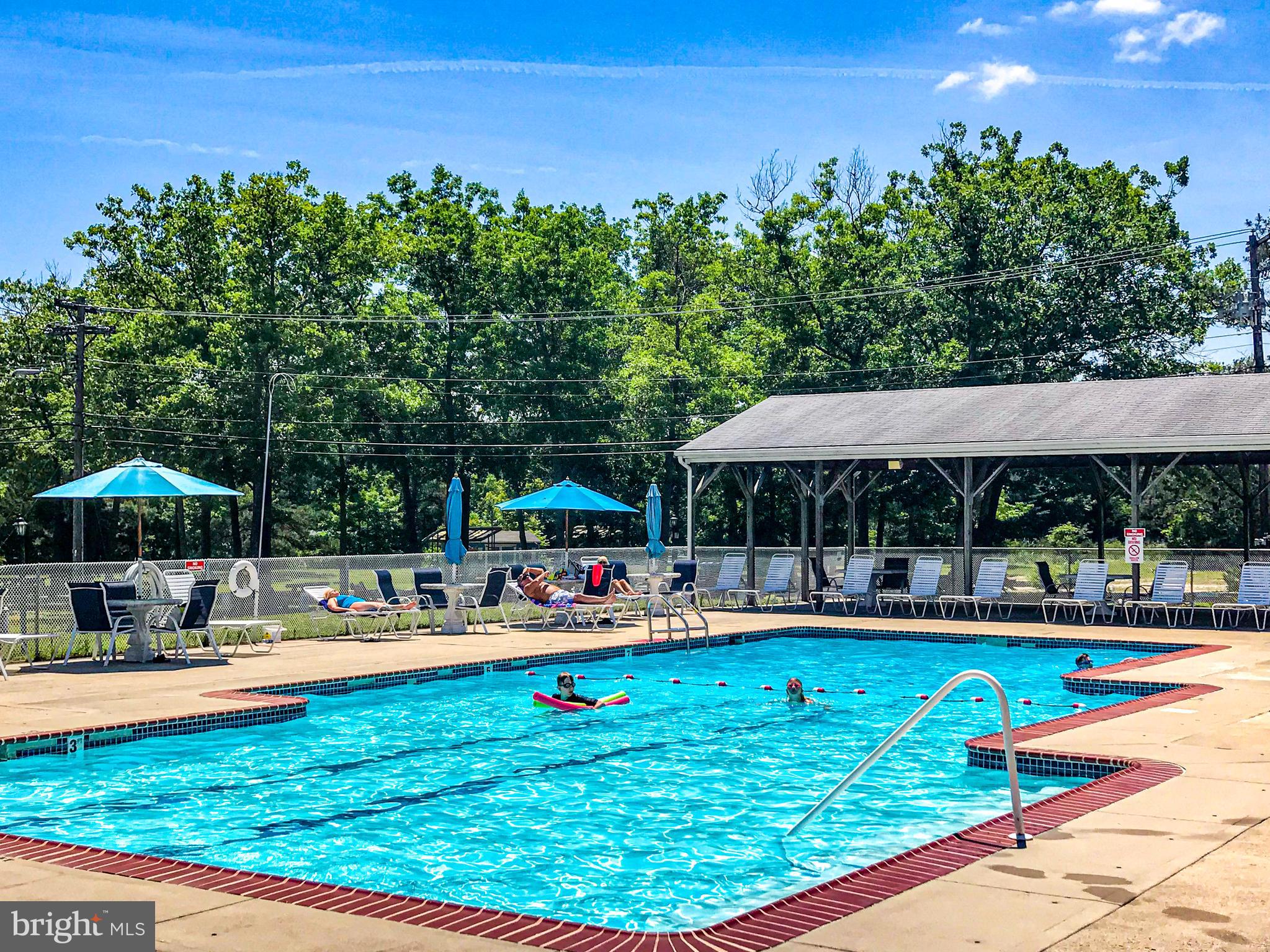 18 B Acorn Road Manahawkin, NJ 08050 - Photo 18 of 19 an outdoor space with swimming pool and furniture