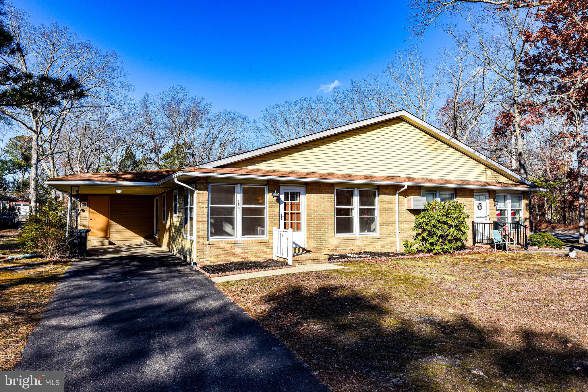18 B Acorn Road Manahawkin, NJ 08050 - Photo 19 of 19 a front view of a house with a yard