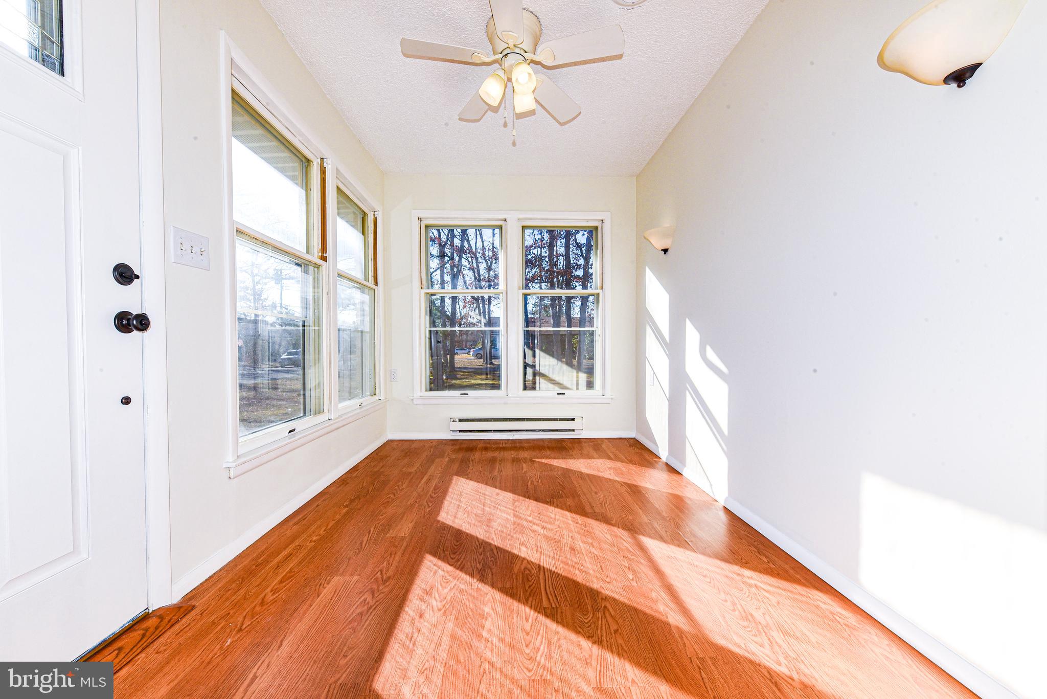 18 B Acorn Road Manahawkin, NJ 08050 - Photo 2 of 19 a view of an empty room with a window