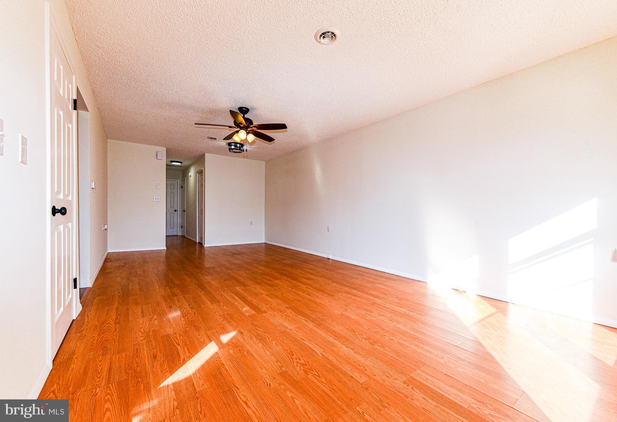 18 B Acorn Road Manahawkin, NJ 08050 - Photo 4 of 19 a view of empty room with a ceiling fan