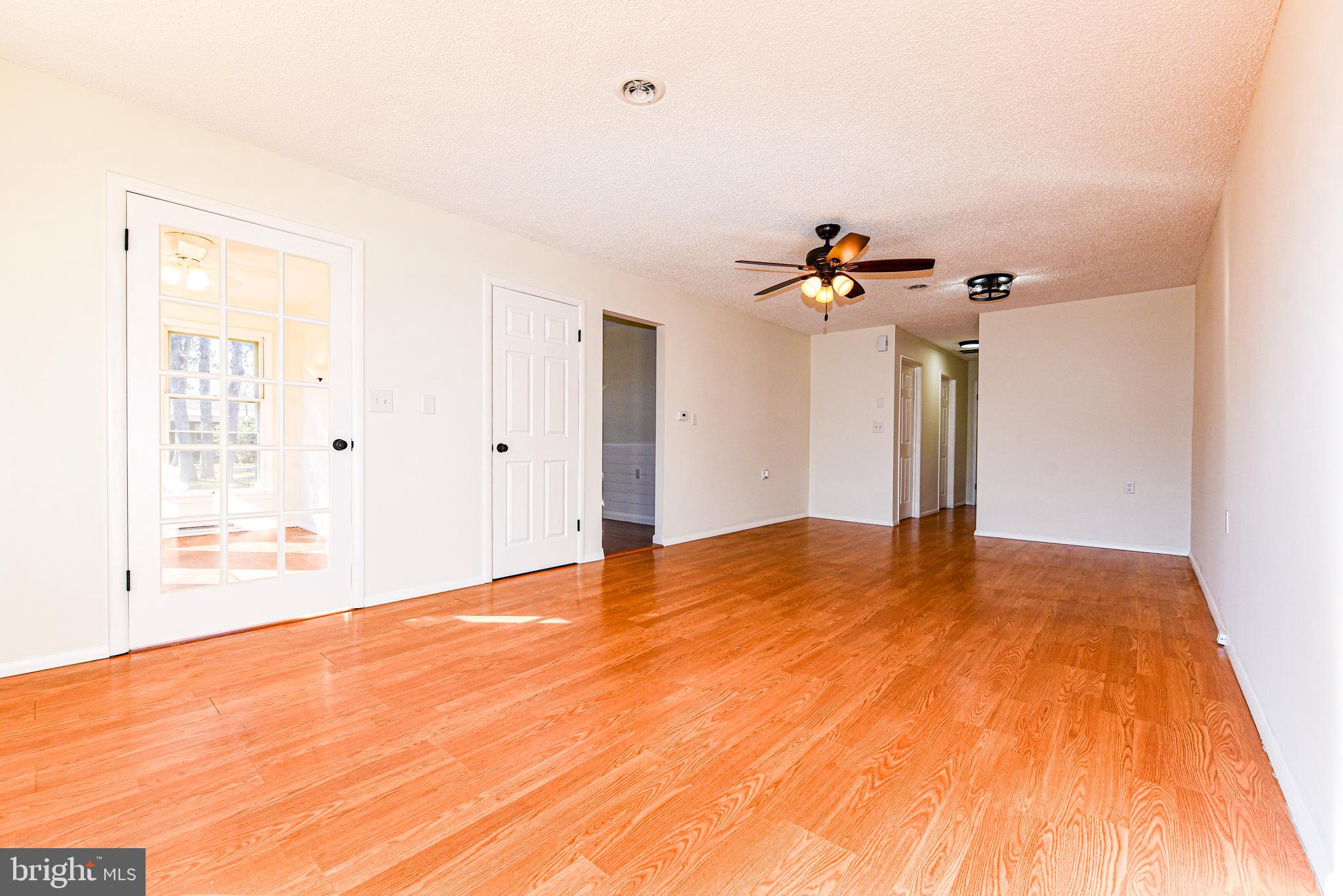 18 B Acorn Road Manahawkin, NJ 08050 - Photo 5 of 19 a view of a room with a ceiling fan