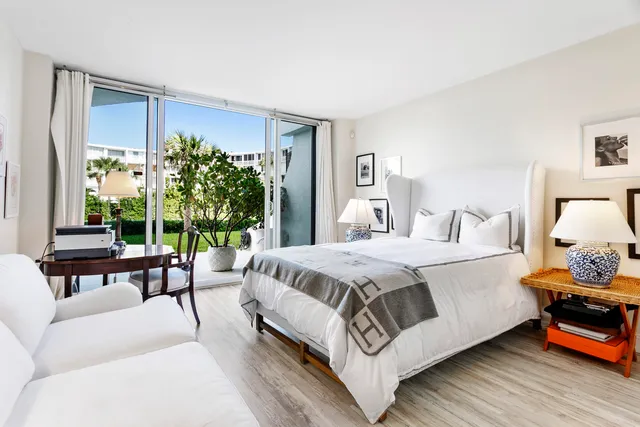 a bathroom with a double vanity sink toilet and shower