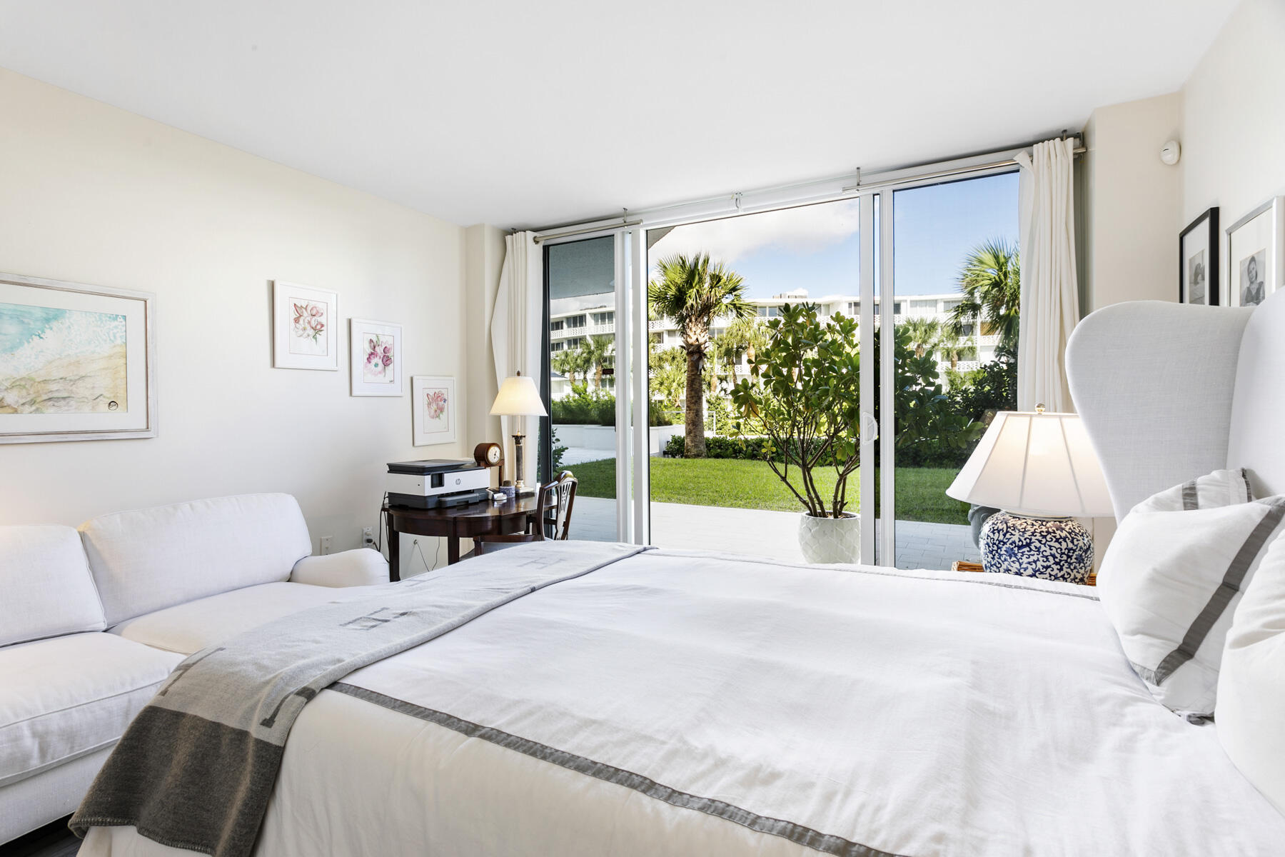 2773 South Ocean Boulevard, Unit 109 Palm Beach, FL 33480 - Photo 13 of 36 a bed room with a bed and a chair