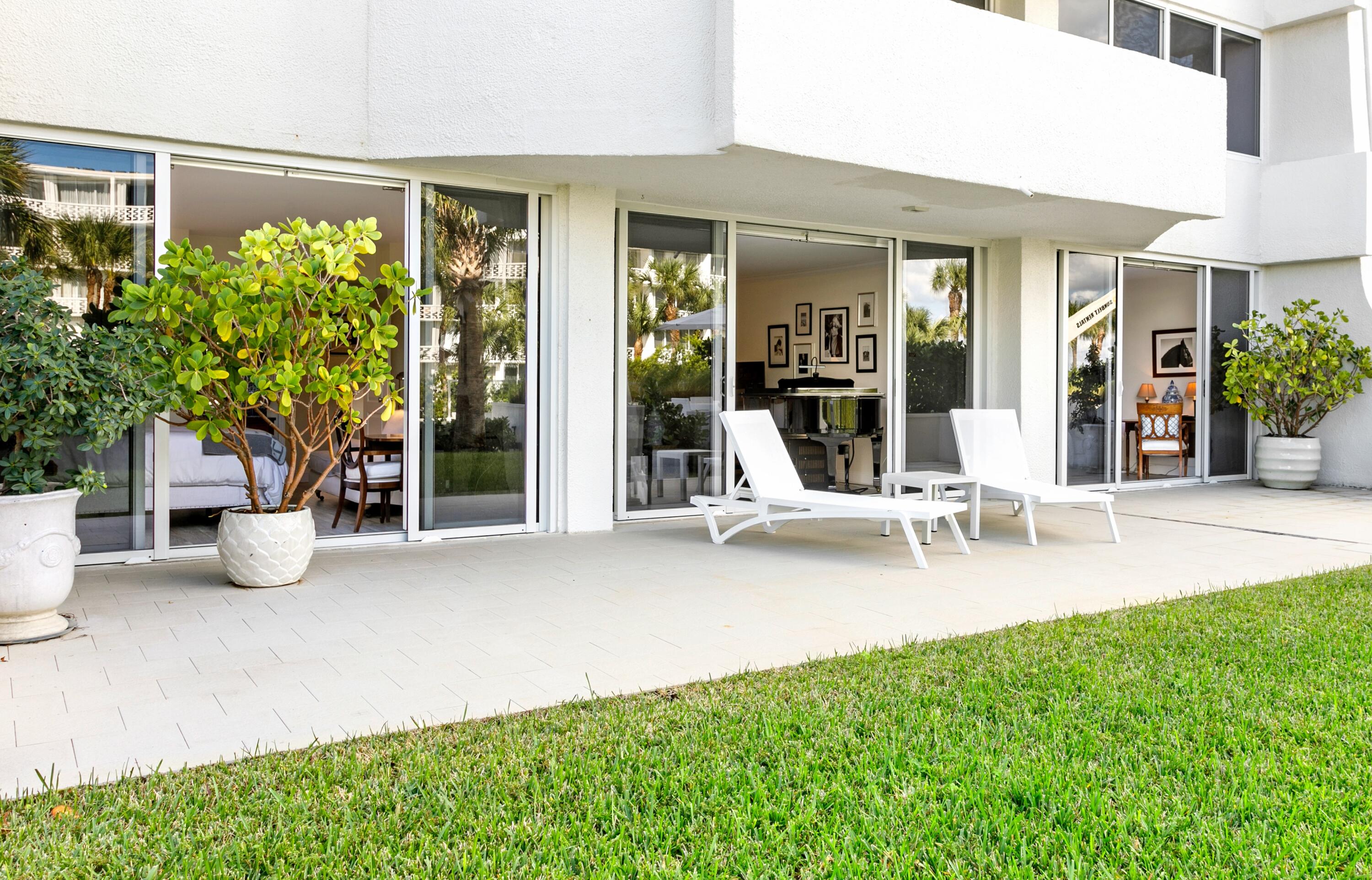 2773 South Ocean Boulevard, Unit 109 Palm Beach, FL 33480 - Photo 17 of 36 a view of a house with backyard porch and sitting area
