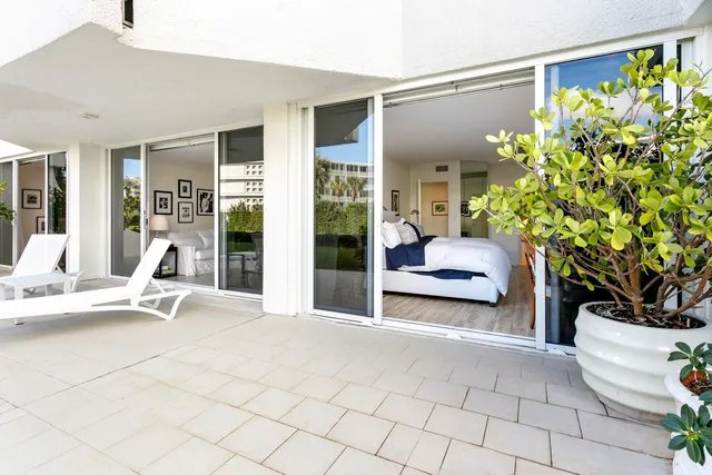 a view of an chairs and table in the patio
