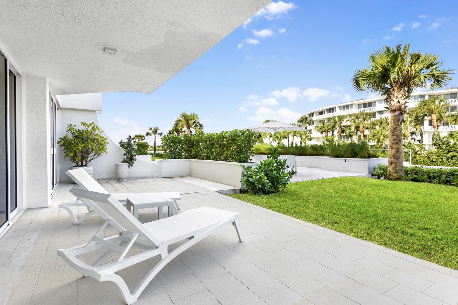 2773 South Ocean Boulevard, Unit 109 Palm Beach, FL 33480 - Photo 20 of 36 a view of a patio with a table and chairs