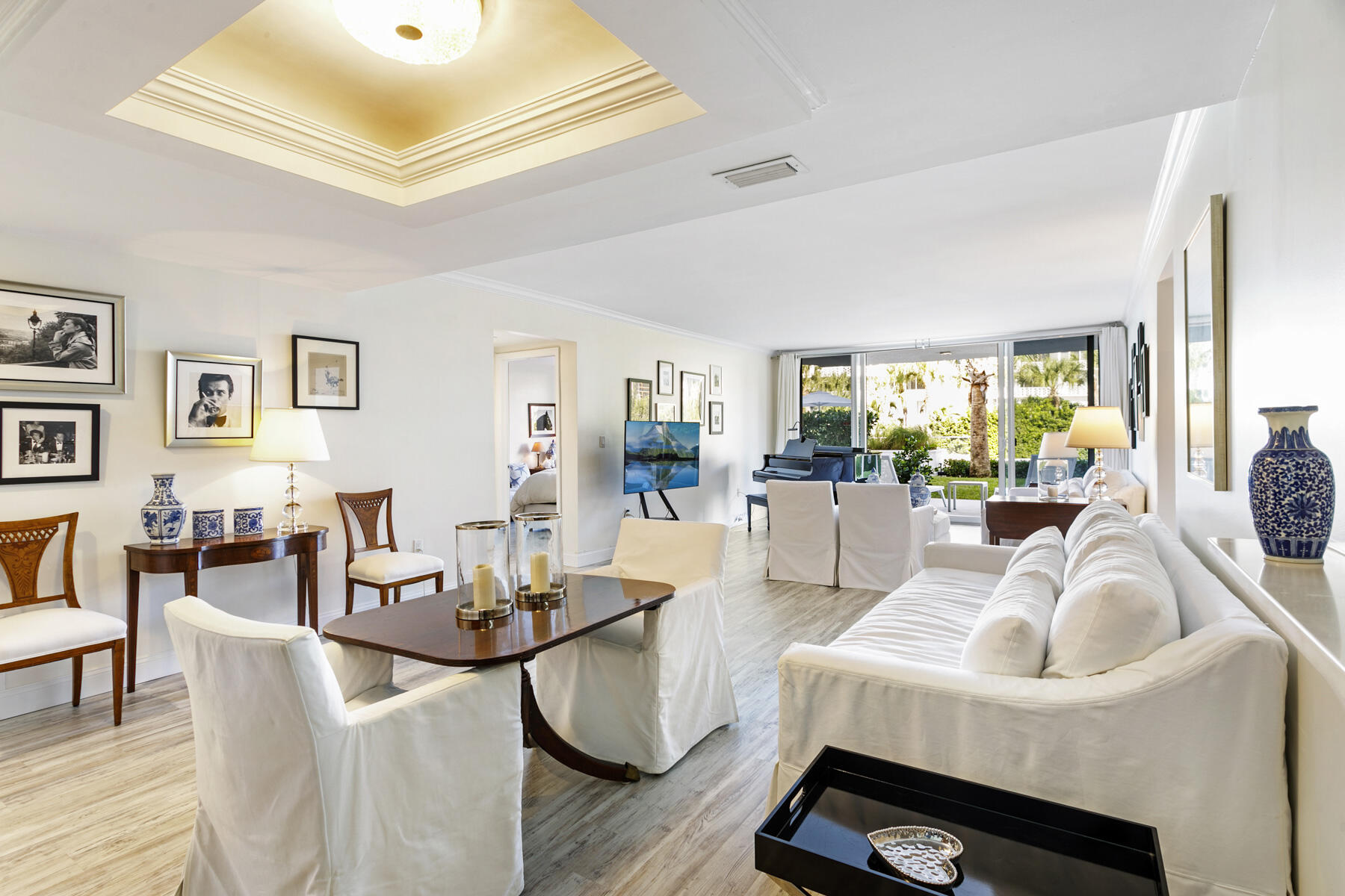 2773 South Ocean Boulevard, Unit 109 Palm Beach, FL 33480 - Photo 2 of 36 a living room with fireplace furniture and a large window